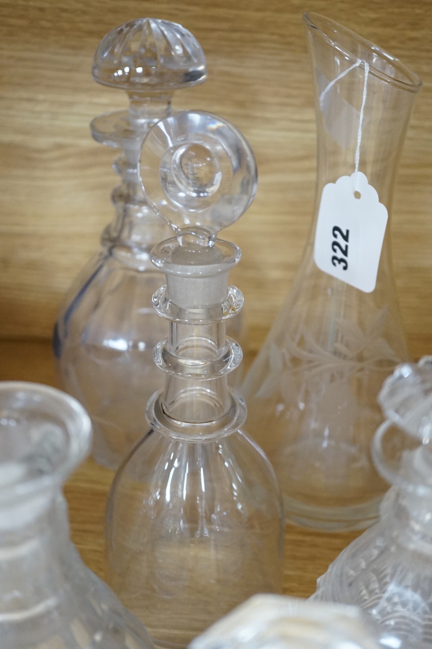 Twelve glass decanters and a carafe (13)